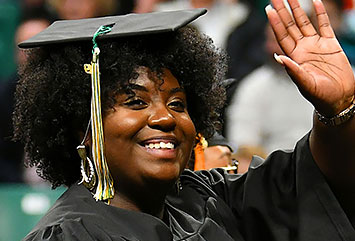 WCC grad waving