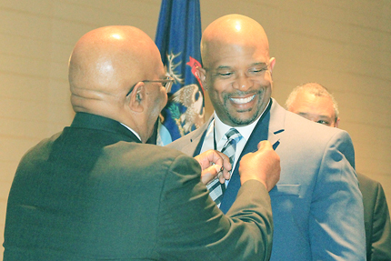 WCC Radiography program director William Nelson (right) has a Technologist of the Year pin placed on his lapel by his father, Robert Nelson, who won the same award in 1986.