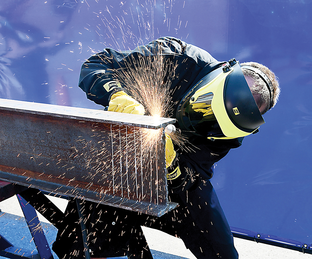 Brian Gelnaw, a member of Ironworkers Local 11 in Bloomfield, N.J., tests a plasma cutting torch during vendor night at the 2017 Ironworkers Instructor Training Program at Washtenaw Community College. The week-long event brought nearly 800 Ironworkers to the community. (Photo by Lon Horwedel)