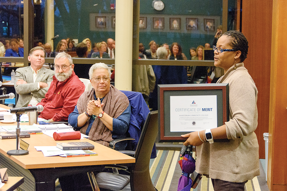 Surgical Technology program director Elizabeth Connors (right) accepts a certificate of merit from the National Board of Surgical Technology and Surgical Assisting on behalf of WCC at the October meeting of the college’s Board of Trustees as trustee Ruth Hatcher looks on. | Photo by CJ South