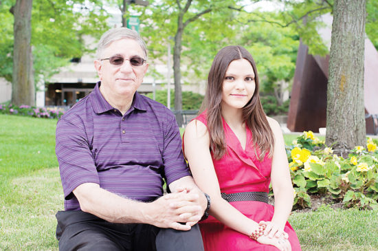 Not ready for retirement, 70-year-old Evans Koukios (left) became an emeritus student at Washtenaw Community College, taking photography classes alongside his daughter, Maria. (Photo by Jessica Bibbee)