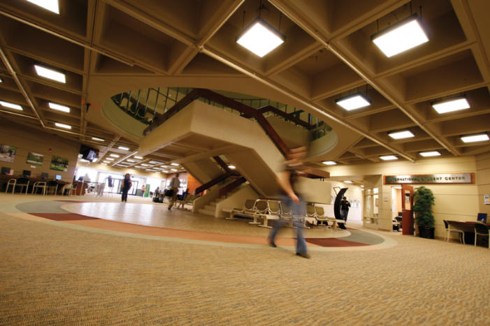 student walking in Student Center lobby